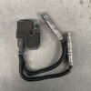 Automotive sensor module with two flexible metal hoses and connectors resting on a gray surface (likely part of a hydraulic or fuel system). Mercedes-Benz Genuine IGNITION COIL Pack / A0001587803 / M112, M113 Engine  #3 #4 » JDM-PARTS NZ