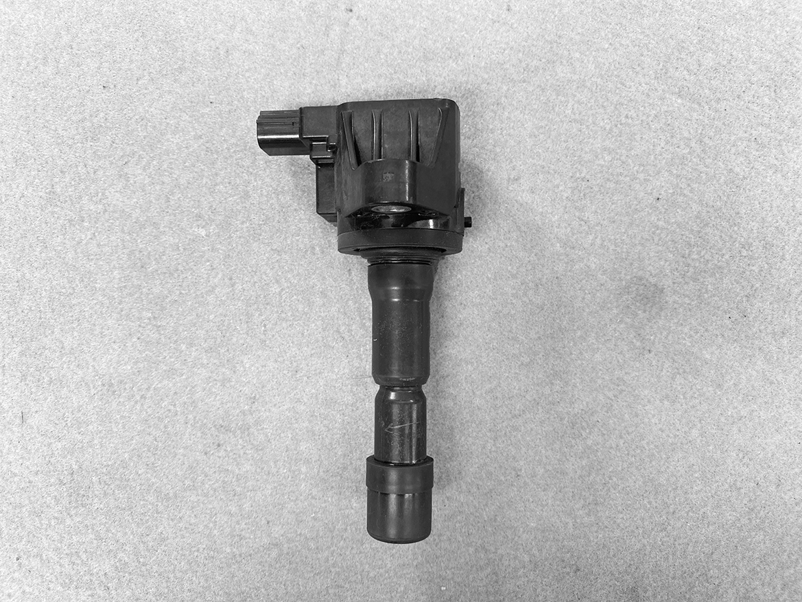 HON-COIL-CM11-116_1 HONDA Genuine IGNITION COIL CM11-116 / L-series Engine » NZ.95 » JDM-PARTS NZ » JDM-PARTS NZ Automotive ignition coil with electrical connector and boot on a gray surface HONDA Genuine IGNITION COIL CM11-116 / L-series Engine » JDM-PARTS NZ