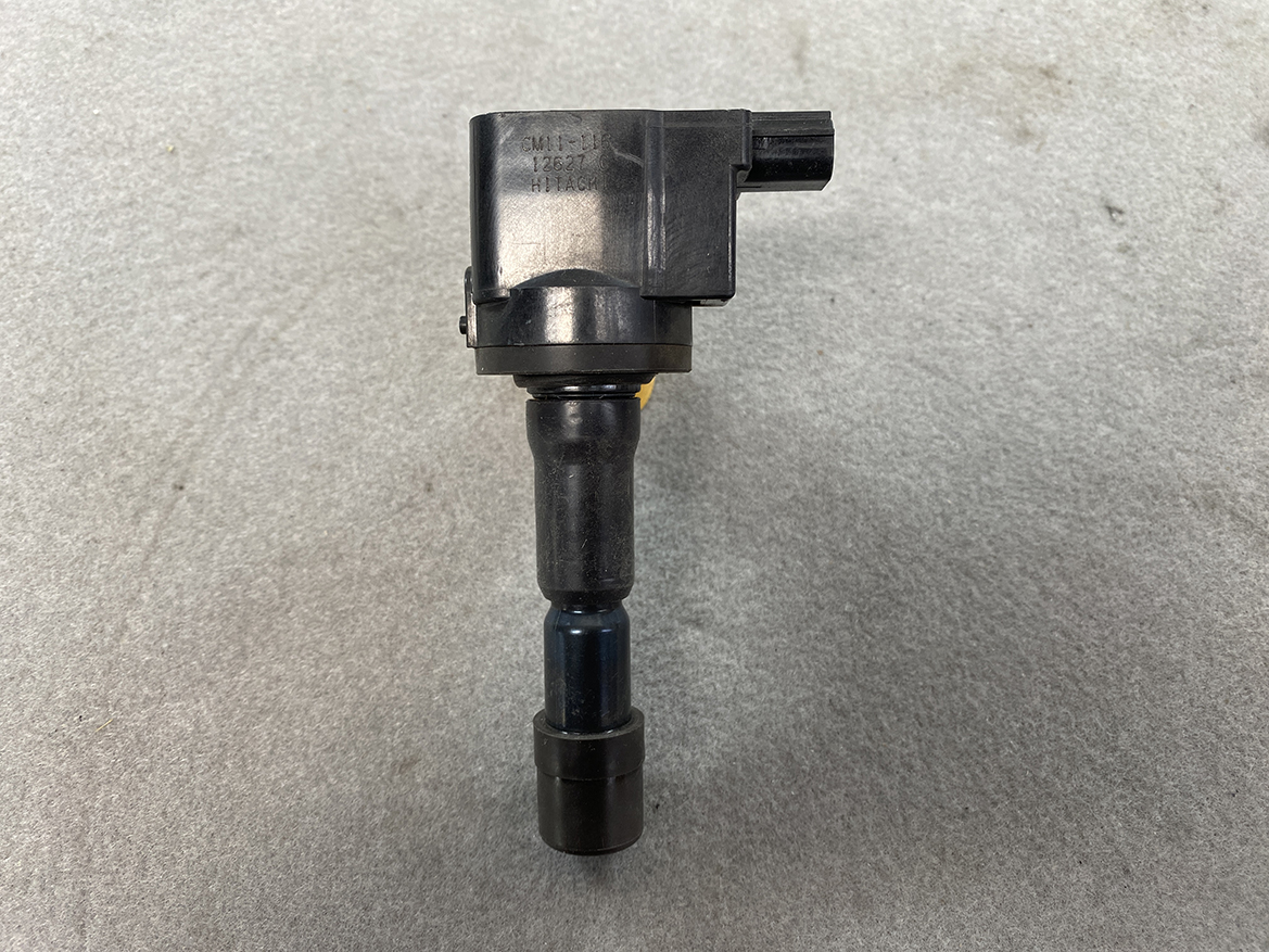 HON-COIL-CM11-116_4 HONDA Genuine IGNITION COIL CM11-116 / L-series Engine » NZ.95 » JDM-PARTS NZ » JDM-PARTS NZ Ignition coil with a plug boot and electrical connector on a gray surface HONDA Genuine IGNITION COIL CM11-116 / L-series Engine » JDM-PARTS NZ