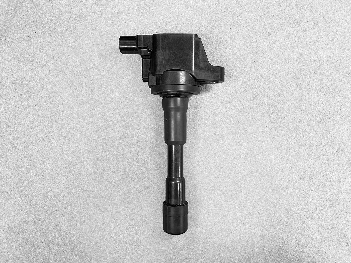 HON-COIL-CM11-119_1 HONDA Genuine IGNITION COIL CM11-119 / L-series Engine » NZ.95 » JDM-PARTS NZ » JDM-PARTS NZ Automotive ignition coil with spark plug boot on a gray background HONDA Genuine IGNITION COIL CM11-119 / L-series Engine » JDM-PARTS NZ