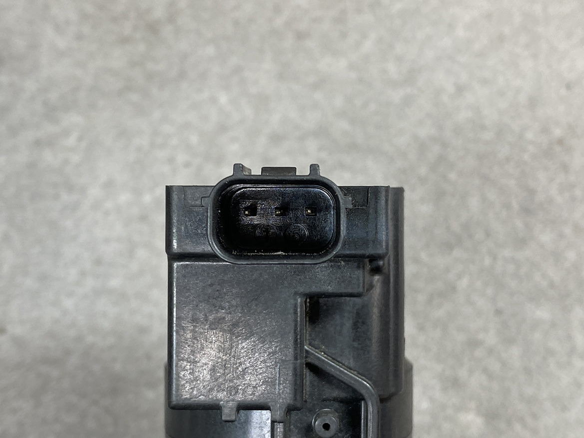 HON-COIL-CM11-119_3 HONDA Genuine IGNITION COIL CM11-119 / L-series Engine » NZ.95 » JDM-PARTS NZ » JDM-PARTS NZ Close-up of a black rectangular module with a three-pin oval automotive connector on top, viewed head-on. HONDA Genuine IGNITION COIL CM11-119 / L-series Engine » JDM-PARTS NZ