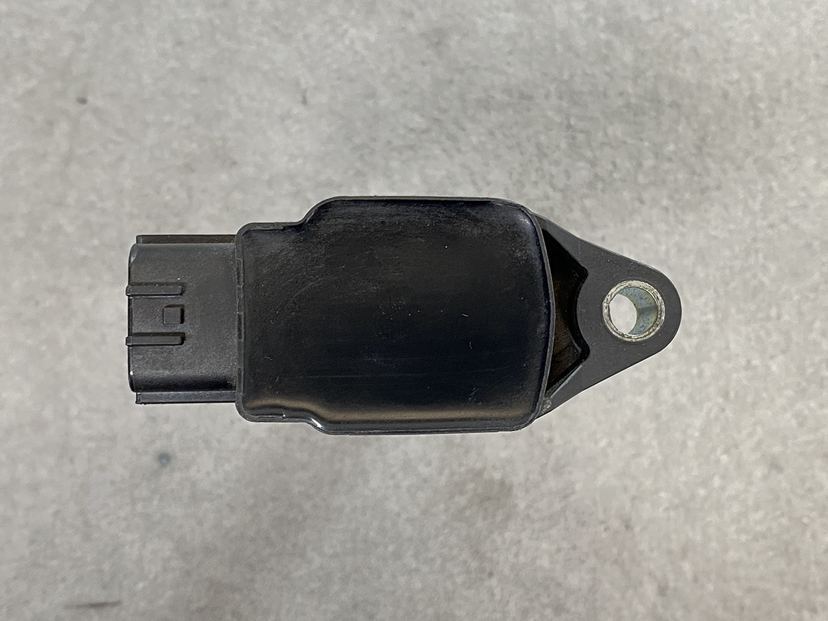 MAZ-COIL-ZJ20_6 MAZDA Genuine IGNITION COIL K5014 / ZJ20-18-100 / Z-series Engine » NZ.95 » JDM-PARTS NZ » JDM-PARTS NZ Automotive sensor with a left-side electrical connector and a mounting lug on the right. MAZDA Genuine IGNITION COIL K5014 / ZJ20-18-100 / Z-series Engine » JDM-PARTS NZ