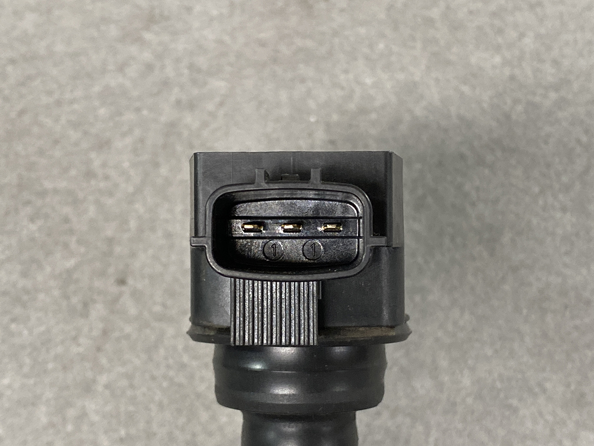 NIS-COIL-1KC0A_3 NISSAN RENAULT Genuine IGNITION COIL 22448 1KC0A / MR, QR Engine » NZ.95 » JDM-PARTS NZ » JDM-PARTS NZ Close-up of a black automotive electrical connector with three exposed metal pins inside. NISSAN RENAULT Genuine IGNITION COIL 22448 1KC0A / MR, QR Engine » JDM-PARTS NZ
