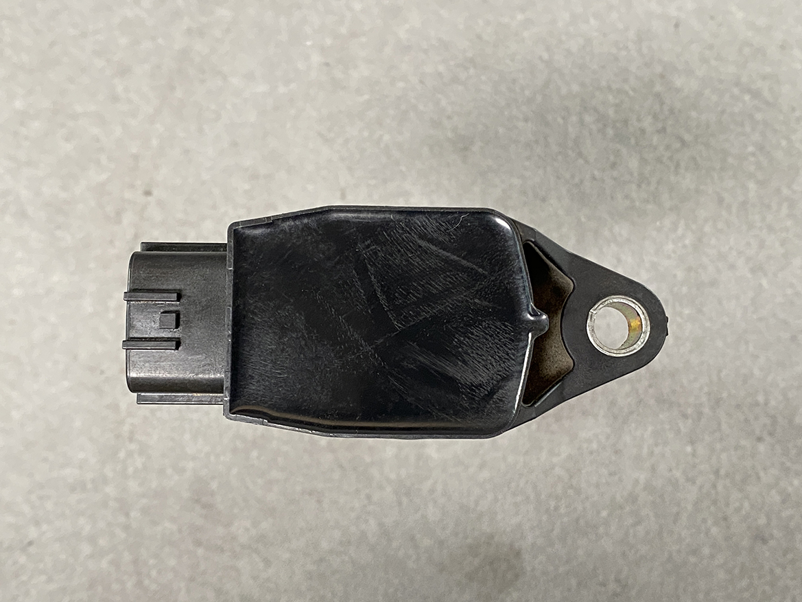 NIS-COIL-1KC0A_6 NISSAN RENAULT Genuine IGNITION COIL 22448 1KC0A / MR, QR Engine » NZ.95 » JDM-PARTS NZ » JDM-PARTS NZ Automotive electronic sensor with a three-pin connector on the left and a mounting ear on the right. NISSAN RENAULT Genuine IGNITION COIL 22448 1KC0A / MR, QR Engine » JDM-PARTS NZ