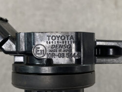Close-up of a Toyota automotive part with Denso branding and part number 90919-02250, made in Japan, showing a circular E11 mark and 10R-03 5444.