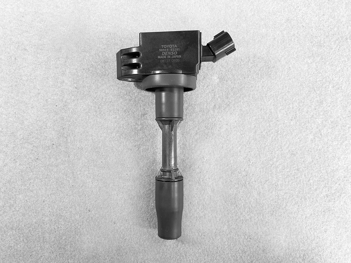 TOY-COIL-02281_1 TOYOTA / DAIHATSU Genuine IGNITION COIL 90919-02281 / NR, KR Engine » NZ.95 » JDM-PARTS NZ » JDM-PARTS NZ Toyota ignition coil with electrical connector on a gray background. TOYOTA / DAIHATSU Genuine IGNITION COIL 90919-02281 / NR, KR Engine » JDM-PARTS NZ