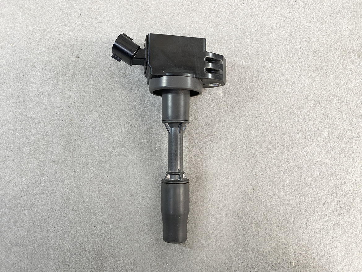 TOY-COIL-02281_4 TOYOTA / DAIHATSU Genuine IGNITION COIL 90919-02281 / NR, KR Engine » NZ.95 » JDM-PARTS NZ » JDM-PARTS NZ Ignition coil with spark plug boot and electrical connector on a gray background (auto part). TOYOTA / DAIHATSU Genuine IGNITION COIL 90919-02281 / NR, KR Engine » JDM-PARTS NZ