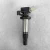 Automotive ignition coil with a rubber spark plug boot and electrical connector on a gray surface. TOYOTA / LEXUS Genuine IGNITION COIL 90919-02258 / 2ZR, 3ZR Engine » JDM-PARTS NZ