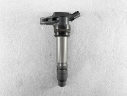 Denso automotive ignition coil lying on a gray textured surface VOLVO LAND ROVER FORD Genuine IGNITION COIL 099700-1070 / 6G9N-12A366 » JDM-PARTS NZ