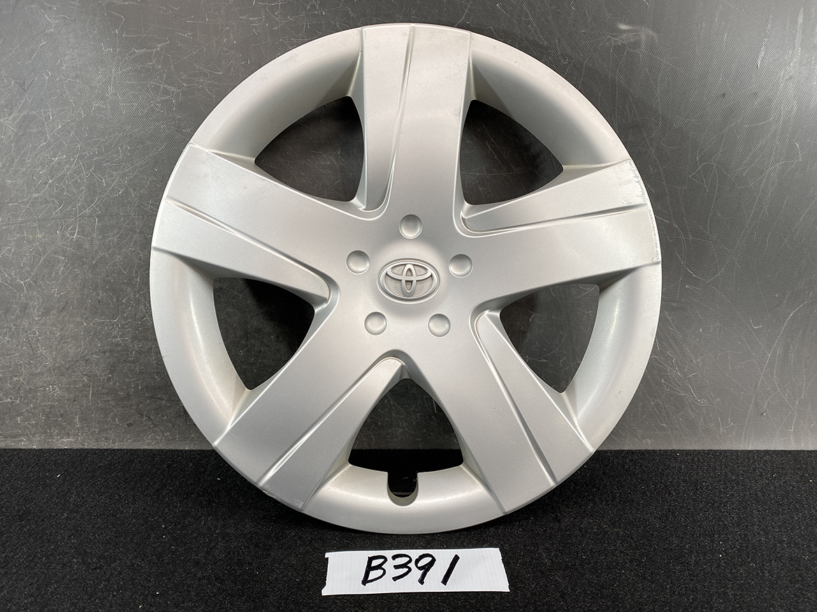 B391_1 TOYOTA RACTIS NSP120, NCP120 Genuine 16inch WHEEL CAP / HUB CAP 42602-52460 » NZ.95 » JDM-PARTS NZ » JDM-PARTS NZ Silver Toyota wheel cover (hubcap) with five-spoke design and centered logo, shown against a dark background. TOYOTA RACTIS NSP120, NCP120 Genuine 16inch WHEEL CAP / HUB CAP 42602-52460 » JDM-PARTS NZ