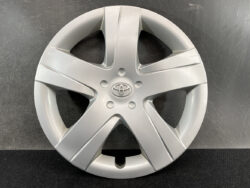 Silver Toyota hubcap with five-spoke design and central emblem