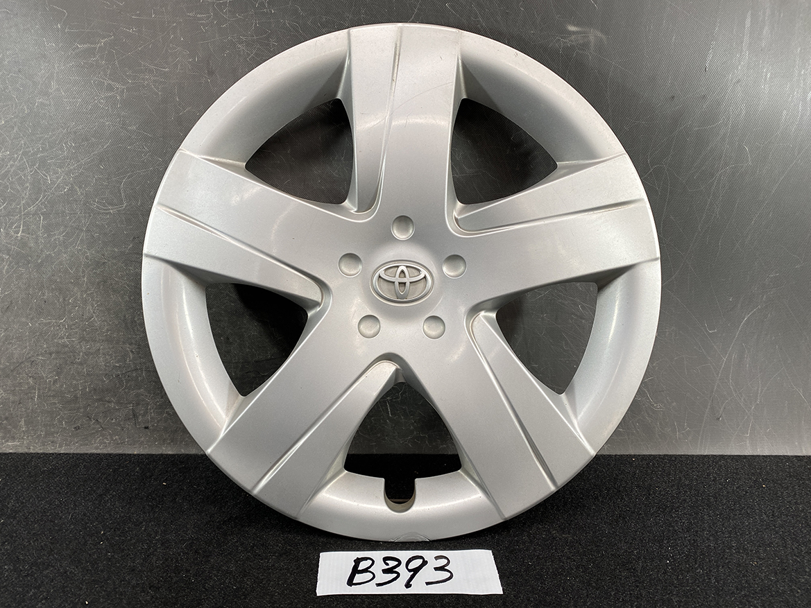 B393_1 TOYOTA RACTIS NSP120, NCP120 Genuine 16inch WHEEL CAP / HUB CAP 42602-52460 » NZ.95 » JDM-PARTS NZ » JDM-PARTS NZ Silver Toyota wheel cover with five spokes, centered Toyota emblem, resting on a dark surface. TOYOTA RACTIS NSP120, NCP120 Genuine 16inch WHEEL CAP / HUB CAP 42602-52460 » JDM-PARTS NZ