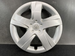 Silver Toyota alloy wheel hubcap with five wide spokes and a central emblem.