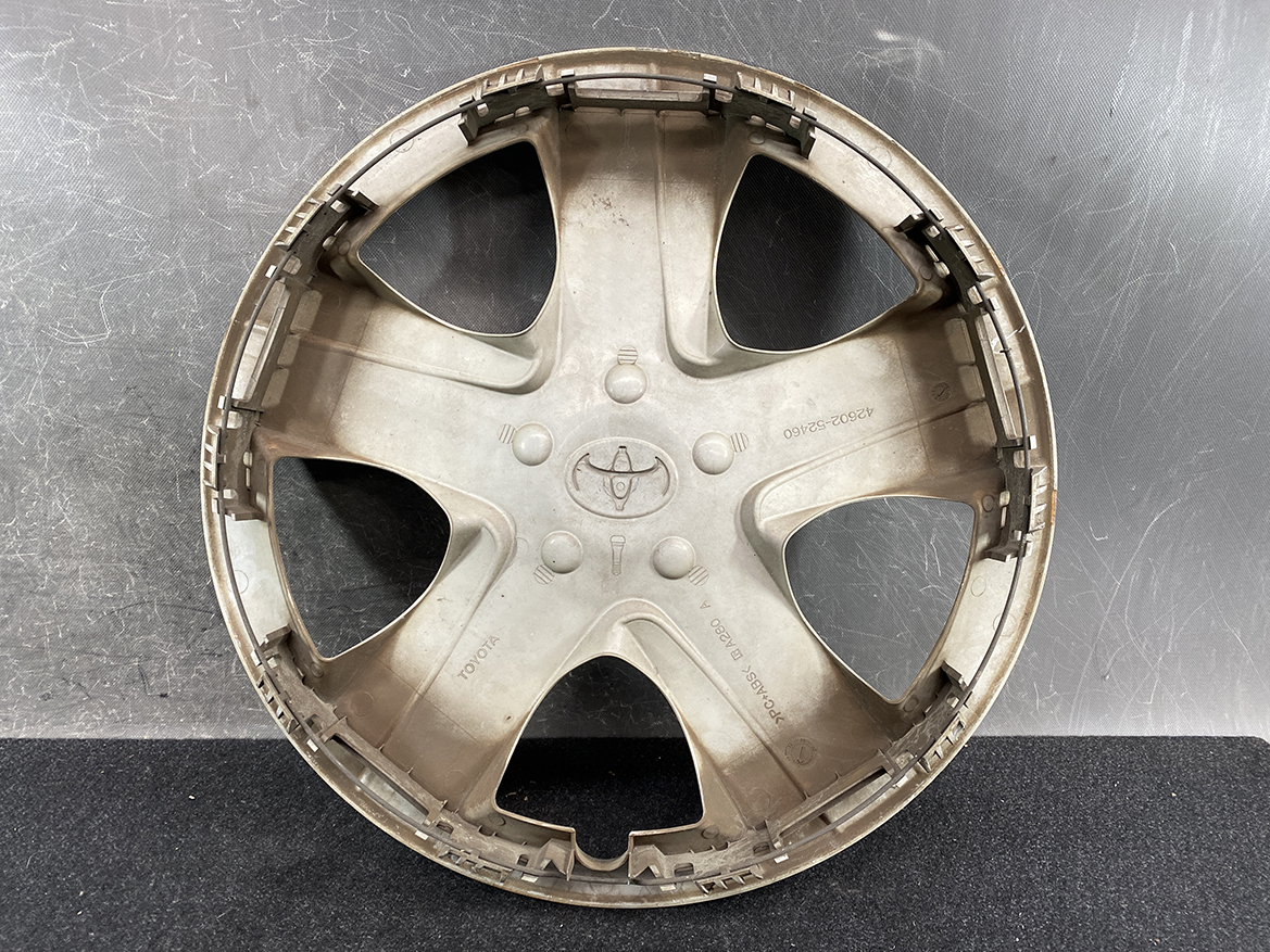 B394_3 TOYOTA RACTIS NSP120, NCP120 Genuine 16inch WHEEL CAP / HUB CAP 42602-52460 » NZ.95 » JDM-PARTS NZ » JDM-PARTS NZ Round beige plastic hubcap with five curved spokes and a central Toyota emblem (dusty). TOYOTA RACTIS NSP120, NCP120 Genuine 16inch WHEEL CAP / HUB CAP 42602-52460 » JDM-PARTS NZ