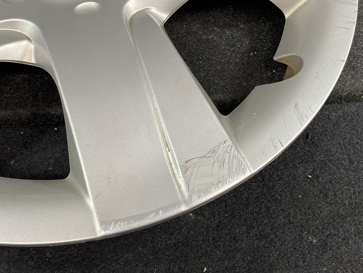 B394_5 TOYOTA RACTIS NSP120, NCP120 Genuine 16inch WHEEL CAP / HUB CAP 42602-52460 » NZ.95 » JDM-PARTS NZ » JDM-PARTS NZ Silver alloy car wheel rim with noticeable curb rash and scratches along the outer edge and some scuffs on the inner curves. TOYOTA RACTIS NSP120, NCP120 Genuine 16inch WHEEL CAP / HUB CAP 42602-52460 » JDM-PARTS NZ