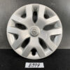Silver Nissan hubcap with an eight-spoke design and central Nissan emblem, resting on a dark surface. TOYOTA PRIUS ZVW50 ZVW51 Genuine 15inch WHEEL CAP / HUB CAP » JDM-PARTS NZ