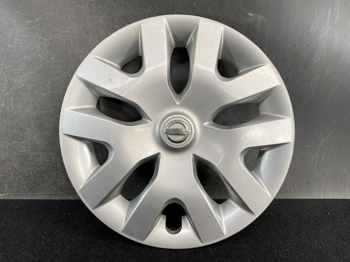 B399_2 NISSAN LEAF AZE0 Genuine 16inch WHEEL CAP / HUB CAP 40315 1KL0B x1 » NZ.95 » JDM-PARTS NZ » JDM-PARTS NZ Silver Nissan hubcap with eight-spoke design and a centered Nissan emblem. NISSAN LEAF AZE0 Genuine 16inch WHEEL CAP / HUB CAP 40315 1KL0B x1 » JDM-PARTS NZ