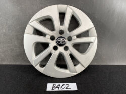 Silver Toyota alloy wheel cover with a multi-spoke design and central Toyota emblem.