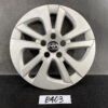Silver Toyota hubcap with a six-spoke alloy design and central emblem, placed on a dark surface. TOYOTA PRIUS ZVW50 ZVW51 Genuine 15inch WHEEL CAP / HUB CAP » JDM-PARTS NZ
