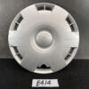 Silver Toyota hubcap/wheel center cap with a circular emblem resting on a dark surface, featuring radial grooves and cutouts around the edge. TOYOTA PRIUS C AQUA NHP10 Genuine 15inch WHEEL CAP / HUB CAP 42602-52540 x1 » JDM-PARTS NZ