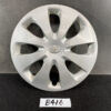 Silver Toyota hubcap with central emblem, photographed against a dark surface. TOYOTA PRIUS C AQUA NHP10 Genuine 15inch WHEEL CAP / HUB CAP 42602-52540 x1 » JDM-PARTS NZ