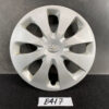 Silver Toyota hubcap with eight teardrop-shaped spokes and center emblem, displayed on a dark surface. TOYOTA PRIUS C AQUA NHP10 Genuine 15inch WHEEL CAP / HUB CAP 42602-52540 x1 » JDM-PARTS NZ
