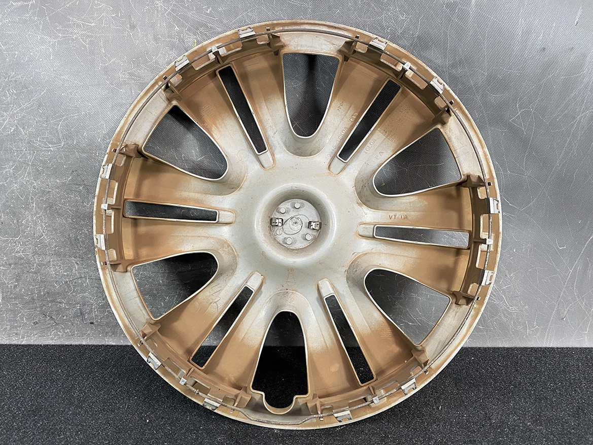 B421_3 NISSAN Genuine 15inch WHEEL CAP / HUB CAP 40315-1GK0A x1 » NZ.95 » JDM-PARTS NZ » JDM-PARTS NZ Gold-colored alloy car wheel rim with multiple curved spokes, viewed head-on against a gray background. NISSAN Genuine 15inch WHEEL CAP / HUB CAP 40315-1GK0A x1 » JDM-PARTS NZ