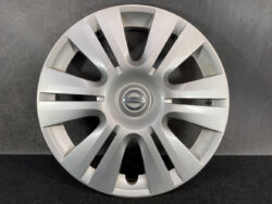 Nissan alloy wheel hubcap with the Nissan emblem in the center