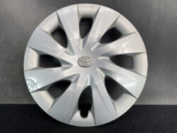 Silver Toyota hubcap with angular spokes and a central Toyota emblem.