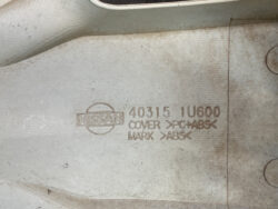 Nissan undercar part with stamped part number 40315 1U600 and material code COVER >PC+ABS