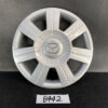 Silver Mazda hubcap with central Mazda logo against a dark backdrop on a black surface. MAZDA DEMIO DY3W Genuine 14inch WHEEL CAP / HUB CAP x1 » JDM-PARTS NZ