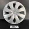 Silver Toyota hubcap with an eight-spoke star design and central logo on a dark surface, labeled 'B447' nearby. TOYOTA VITZ Yaris Genuine 14inch WHEEL CAP / HUB CAP x1 » JDM-PARTS NZ