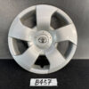 Silver Toyota hubcap with a five-spoke design and central Toyota emblem on a dark surface. TOYOTA SIENTA NCP81G Genuine 14inch WHEEL CAP / HUB CAP 42602-52350 x1 » JDM-PARTS NZ
