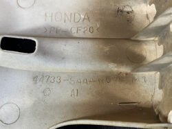 Close-up of a Honda plastic part with molded markings: HONDA, >PP-GF20