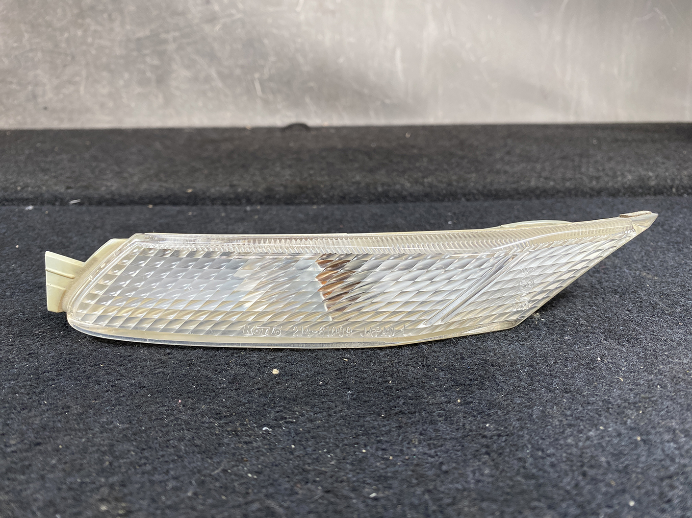 B464_3 MAZDA RX-8 SE3P Genuine Side Indicator KOITO 214-61009 Left Side x1 » NZ.95 » JDM-PARTS NZ » JDM-PARTS NZ Clear plastic car side marker/indicator lens with a diamond pattern texture on a dark surface. MAZDA RX-8 SE3P Genuine Side Indicator KOITO 214-61009 Left Side x1 » JDM-PARTS NZ