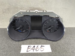 Car instrument cluster with tachometer (x1000 rpm) on the left and speedometer (0–180 km/h) on the right, and a central display screen.