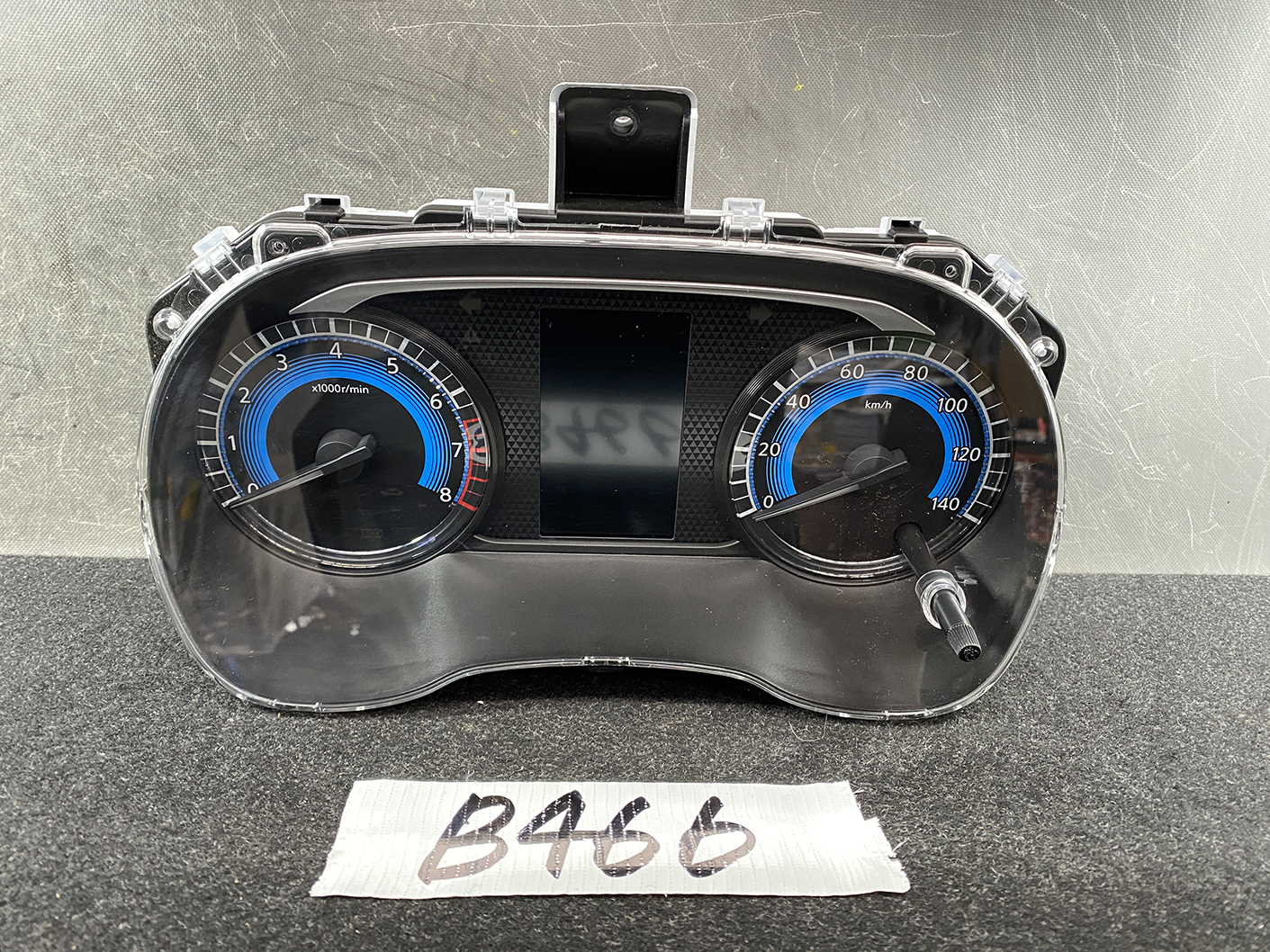 B466_1 NISSAN ROOX B44A Genuine Instrument Cluster 24810 7NB0D » NZ1.95 » JDM-PARTS NZ » JDM-PARTS NZ Vehicle dashboard instrument cluster: left tachometer, right speedometer, and central display with a glossy black bezel. NISSAN ROOX B44A Genuine Instrument Cluster 24810 7NB0D » JDM-PARTS NZ