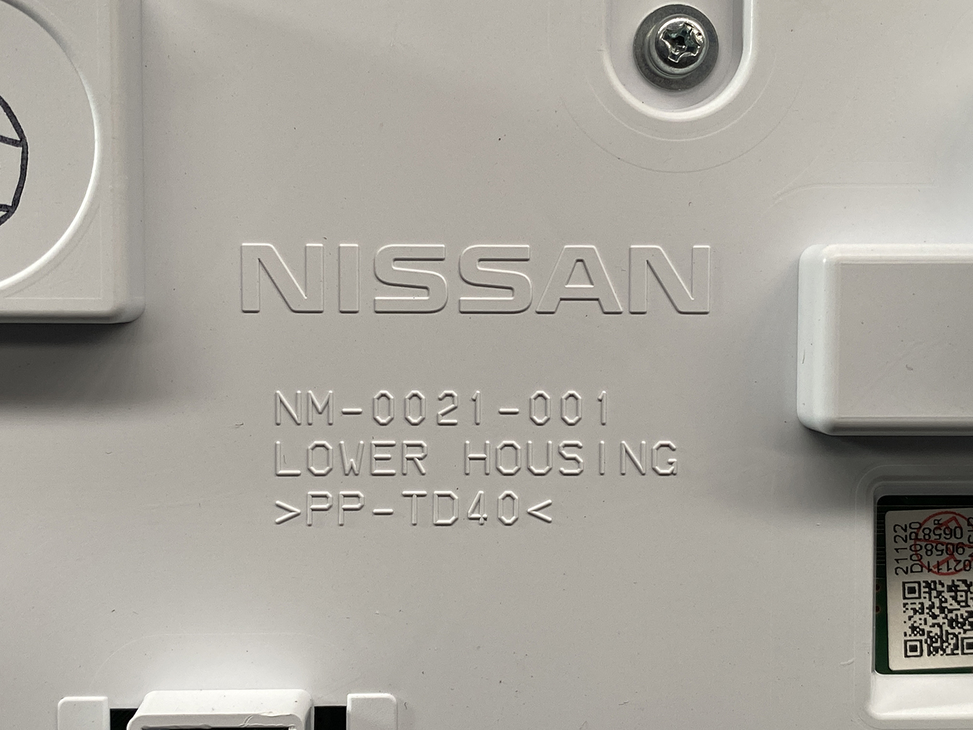 B466_3 NISSAN ROOX B44A Genuine Instrument Cluster 24810 7NB0D » NZ1.95 » JDM-PARTS NZ » JDM-PARTS NZ Close-up of a gray Nissan automotive part with embossed text: NISSAN, NM-0021-001, LOWER HOUSING, >PP-TD40 NISSAN ROOX B44A Genuine Instrument Cluster 24810 7NB0D » JDM-PARTS NZ