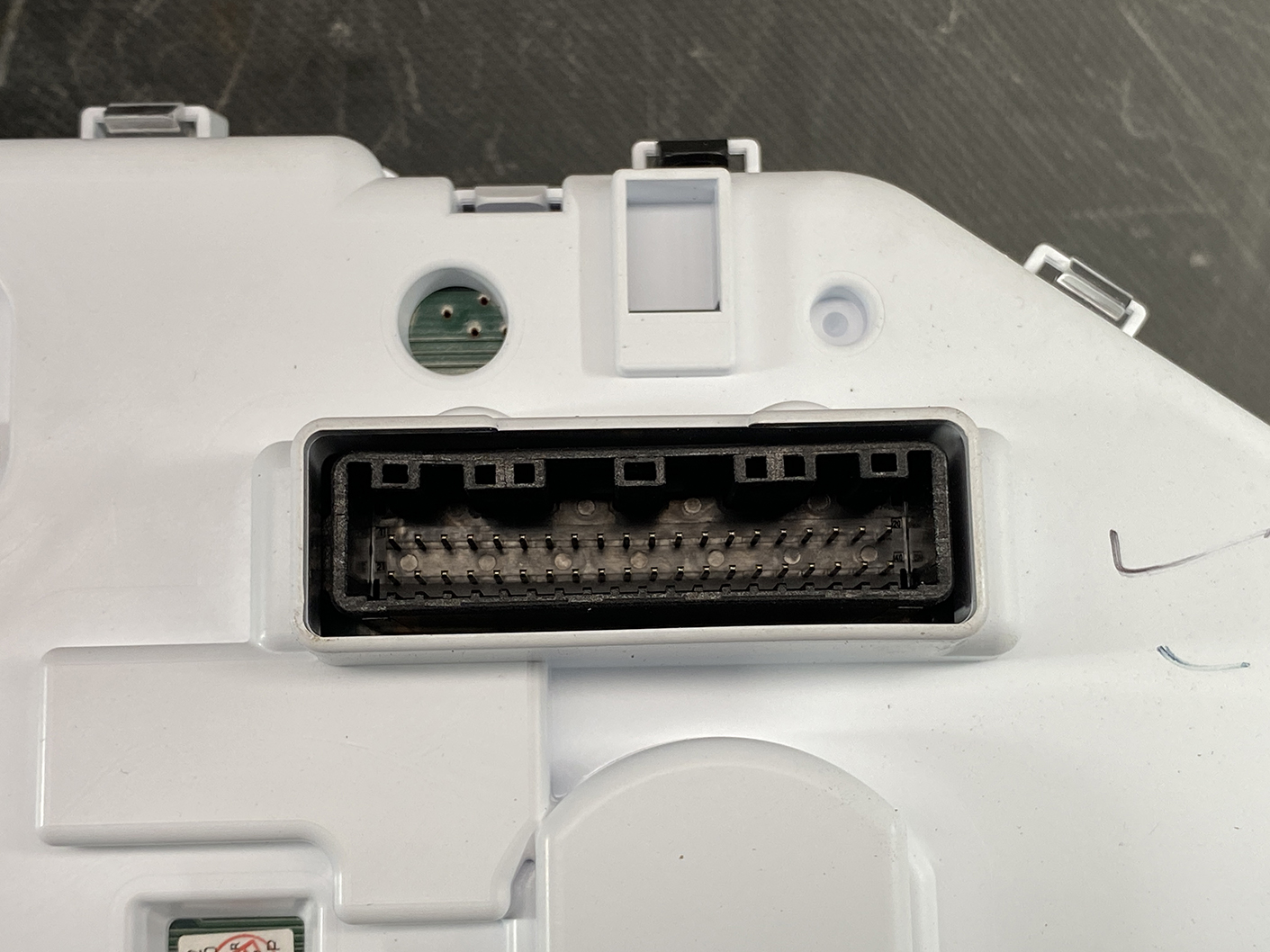 B466_4 NISSAN ROOX B44A Genuine Instrument Cluster 24810 7NB0D » NZ1.95 » JDM-PARTS NZ » JDM-PARTS NZ Close-up of a white plastic electronic module showing a large rectangular multi-pin connector port with many pins, no cover present. NISSAN ROOX B44A Genuine Instrument Cluster 24810 7NB0D » JDM-PARTS NZ