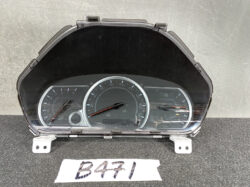 Car instrument cluster with central speedometer up to 180, left tachometer, right fuel gauge; housed in a dark plastic panel.