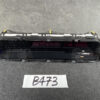 Rear-facing view of a car digital instrument cluster module with two red LED displays and mounting brackets on a dark work surface, tag 'B473' in front. TOYOTA VOXY NOAH ESQUIRE ZRR80 Genuine Instrument Cluster 83800-28M00-C » JDM-PARTS NZ