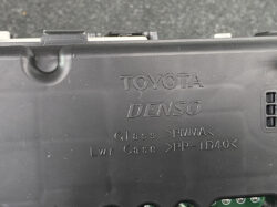 Back of a black plastic Toyota Denso module case with molded text reading Glass PMMA and Lwr Case PP-TD40