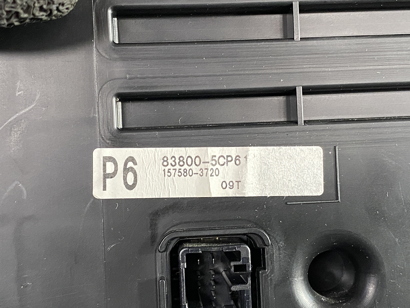 B474_3 TOYOTA SIENTA NHP170 Genuine Instrument Cluster 83800-5CP61 » NZ1.95 » JDM-PARTS NZ » JDM-PARTS NZ Close-up of a sticker on a black device: P6, numbers 83800-5CP6 and 157580-3720, with a connector at bottom. TOYOTA SIENTA NHP170 Genuine Instrument Cluster 83800-5CP61 » JDM-PARTS NZ