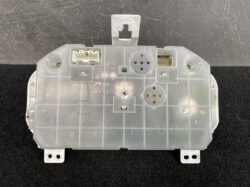 Rear view of a car instrument cluster module with multiple electrical connectors and mounting tabs.