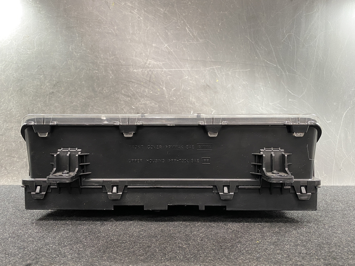 B480_7 NISSAN NV350 CARAVAN E26 Genuine Instrument Cluster 3YB0D TYPE: 883B » NZ1.95 » JDM-PARTS NZ » JDM-PARTS NZ Black plastic electrical ECU-style module with a clear snap-on lid and multiple side latches, viewed from the back. NISSAN NV350 CARAVAN E26 Genuine Instrument Cluster 3YB0D TYPE: 883B » JDM-PARTS NZ