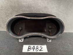 Vehicle instrument cluster showing left tachometer and right speedometer with orange needles; central digital display. Jeep Grand Cherokee WK57A Genuine Instrument Cluster 68235673AA » JDM-PARTS NZ