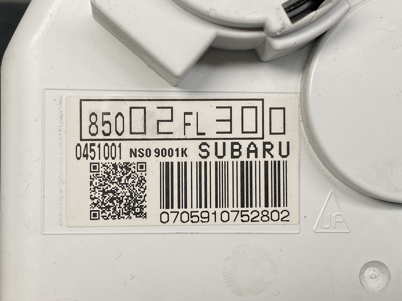 B484_3 SUBARU IMPREZA SPORTS GT2 Genuine Instrument Cluster 85002FL300 / NS0 9001K » NZ1.95 » JDM-PARTS NZ » JDM-PARTS NZ Close-up of a white device label with a barcode, QR code, and 'SUBARU' text on a white automotive part. SUBARU IMPREZA SPORTS GT2 Genuine Instrument Cluster 85002FL300 / NS0 9001K » JDM-PARTS NZ