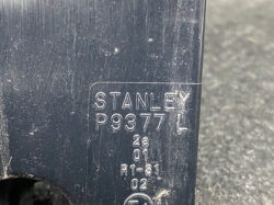 Close-up of a dark blue plastic surface with a raised Stanley label reading P9377 and additional small stamped codes (L, 2a, 01, R1-S1, 02).