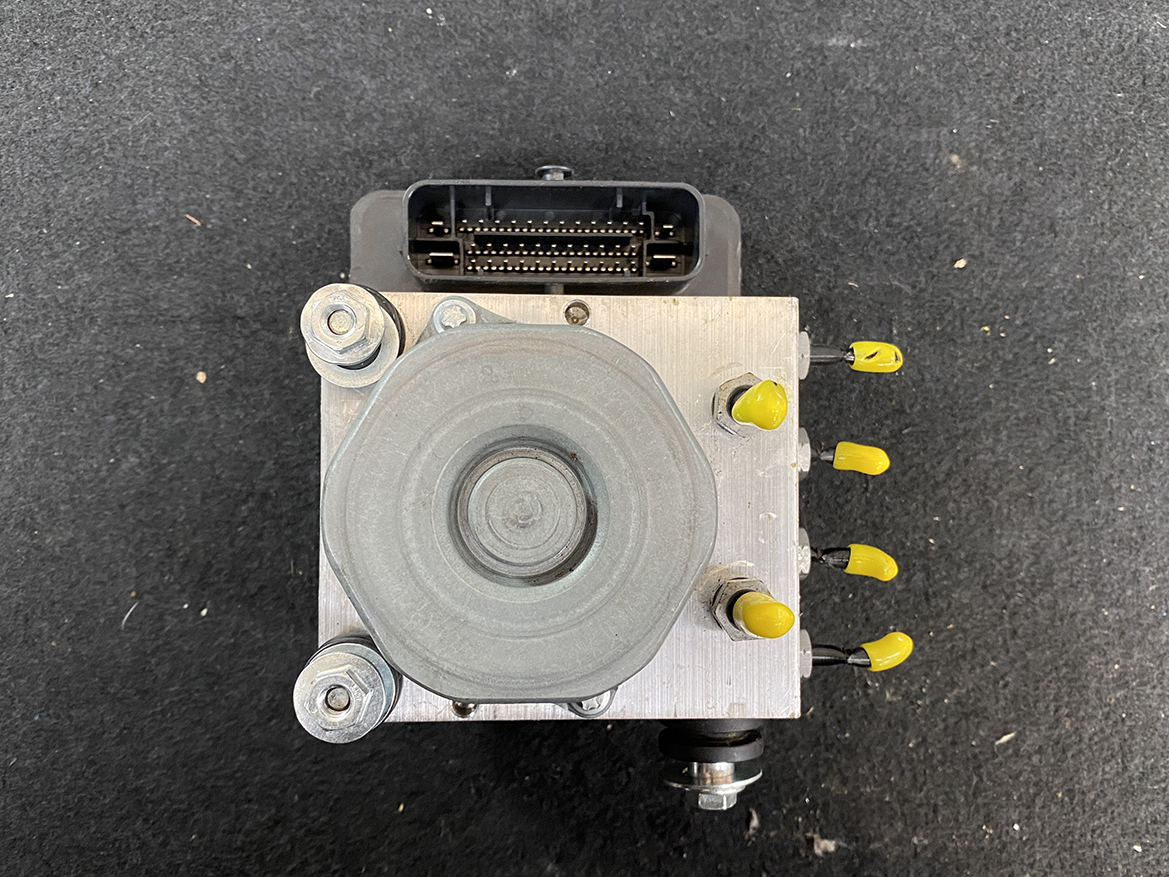 BNZ-ACTR-A000431 _12 Mercedes Benz Genuine ABS Actuator Pump A000 431 23 00 / 0 265 255 634 » NZ9.95 » JDM-PARTS NZ » JDM-PARTS NZ Automotive ABS brake modulator with an electrical connector on top and yellow-capped ports on the side. Mercedes Benz Genuine ABS Actuator Pump A000 431 23 00 / 0 265 255 634 » JDM-PARTS NZ