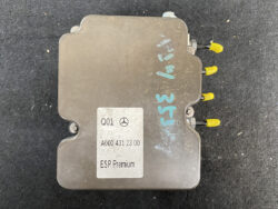 Mercedes ESP Premium electronic control unit (ECU) with yellow connector pins visible on the side and a white label reading ESP Premium, A000 431 23 00.